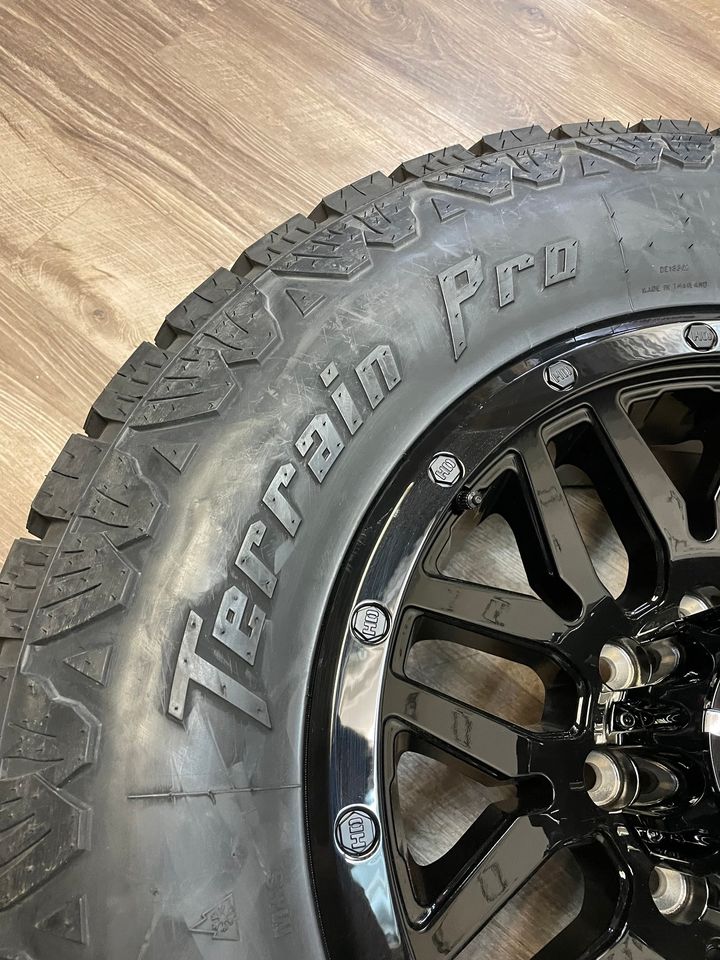 275/70/18 AMP All weather tires Black Rims GMC Chevy 2500 3500