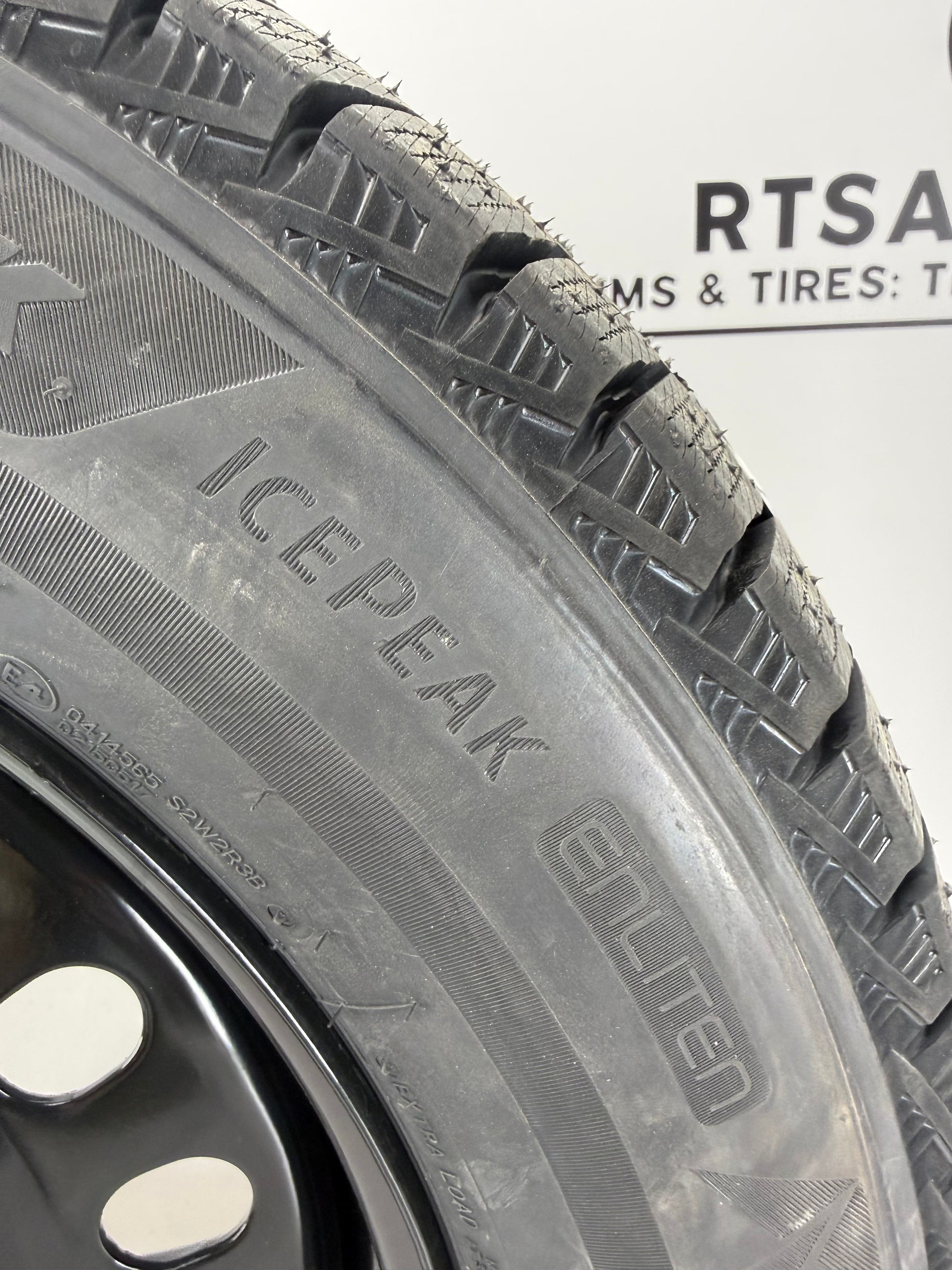 Bridgestone Blizzak Icepeak winter tire on a black steel rim - R&T Sales