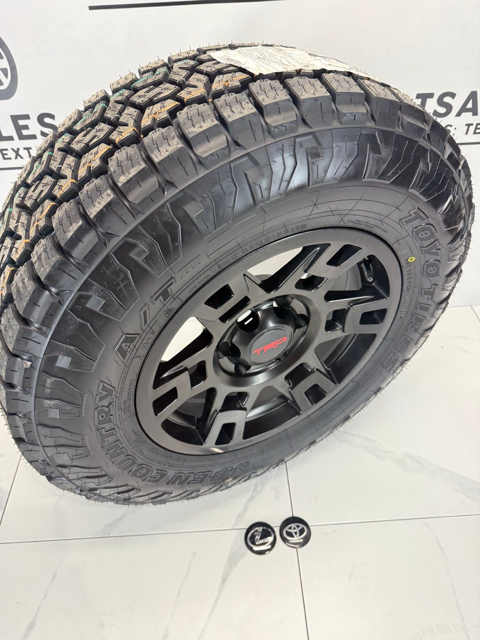 LT 265/70/17 Toyo 17x8 Replika R213 Rims 6x139