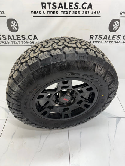 265/70/17 AMP Pro All Terrain Tires on 17" Replica Rims 6x139