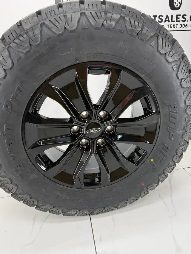 LT 275/70/18 AMP Pro tires on 18x8.5 Replica R250 rims 6x135
