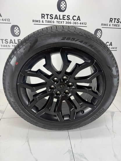 285/45R22 Pirelli Scorpion Verde all season tire on a black 22x9 Ram 1500 factory OEM rim, face view
