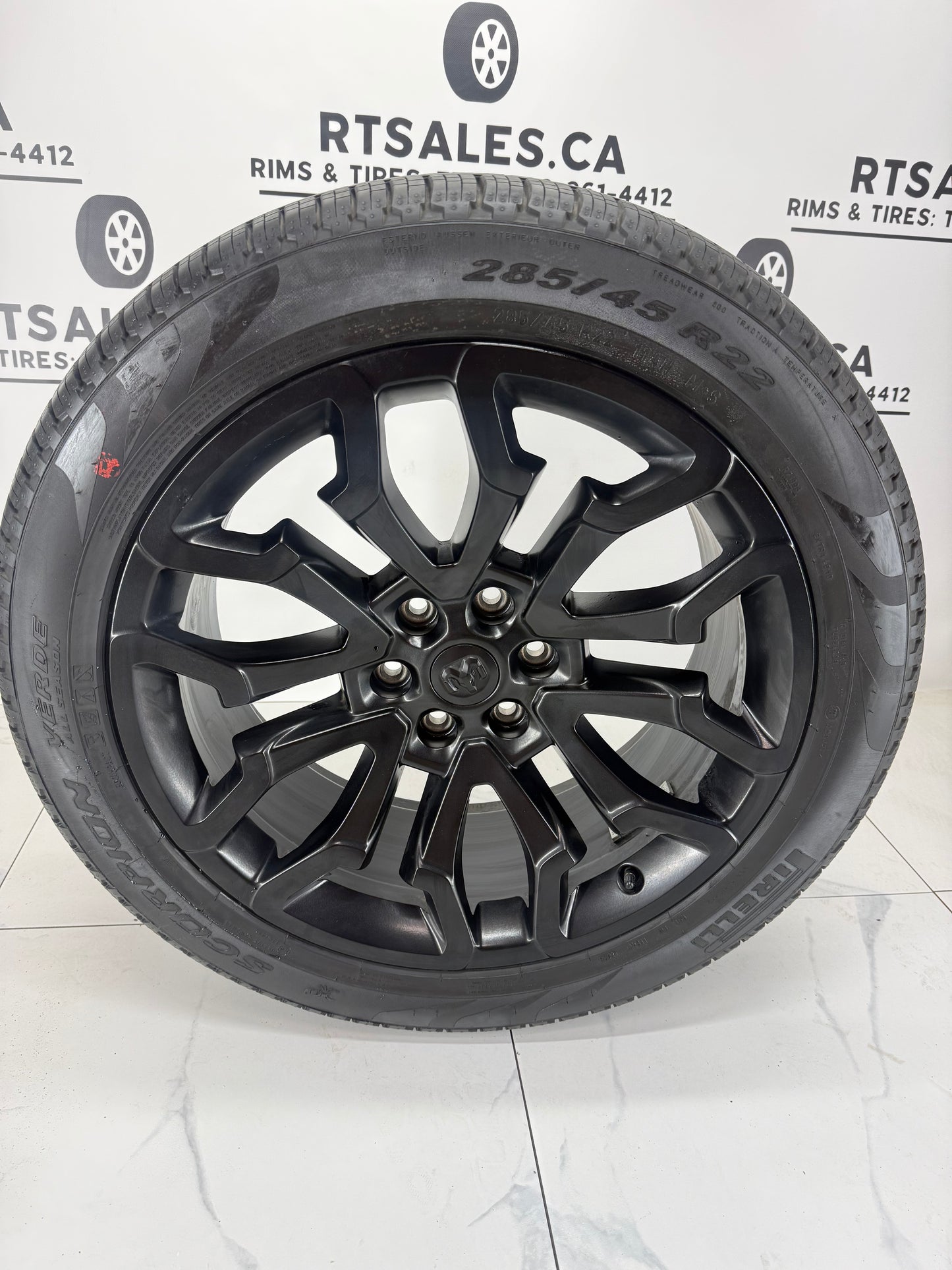 22 inch black Ram 1500 OEM takeoff wheel with 285/45R22 Pirelli Scorpion Verde tire