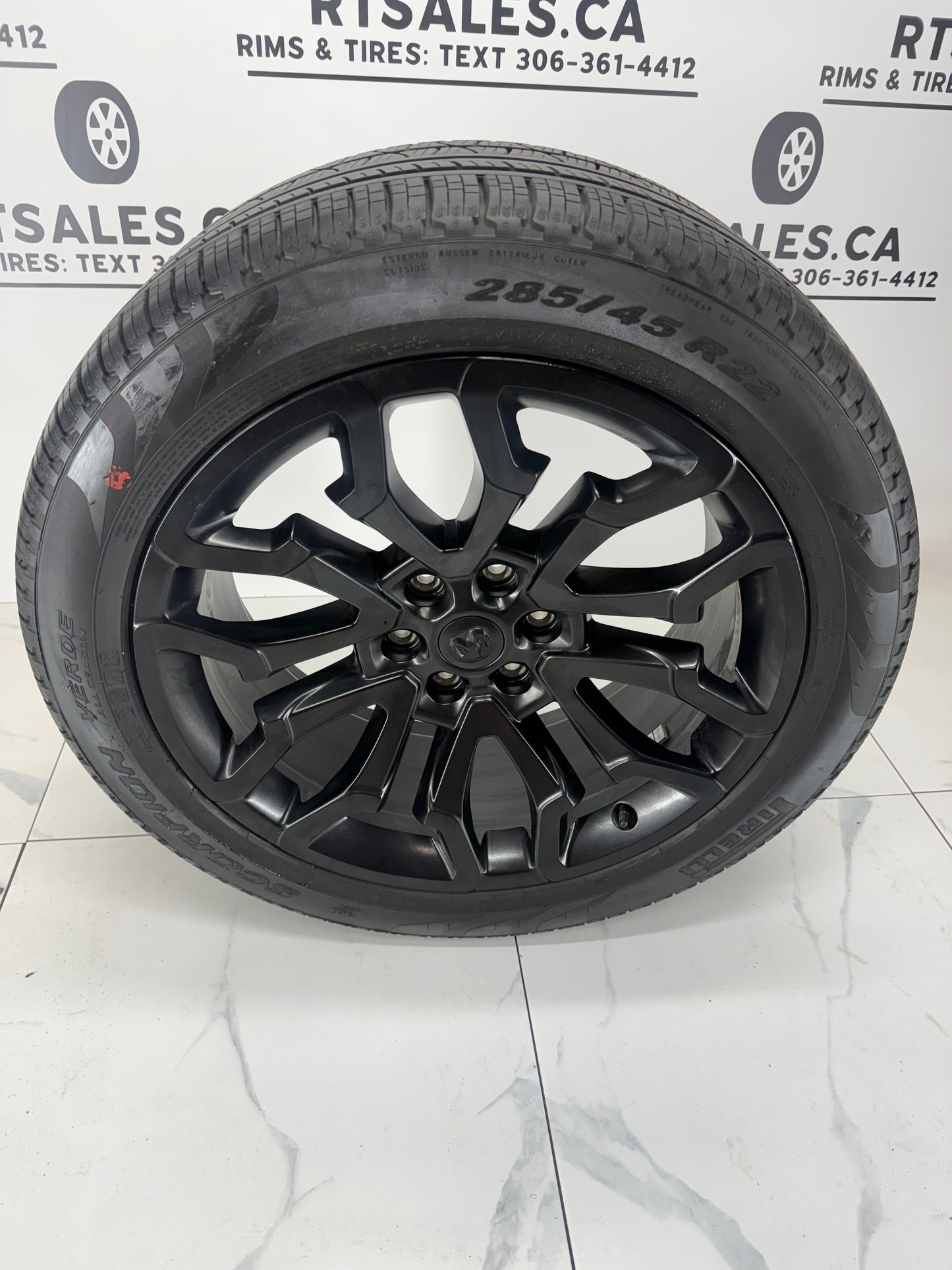 Ram 1500 22x9 factory black rim, 6x139.7 bolt pattern, angled view