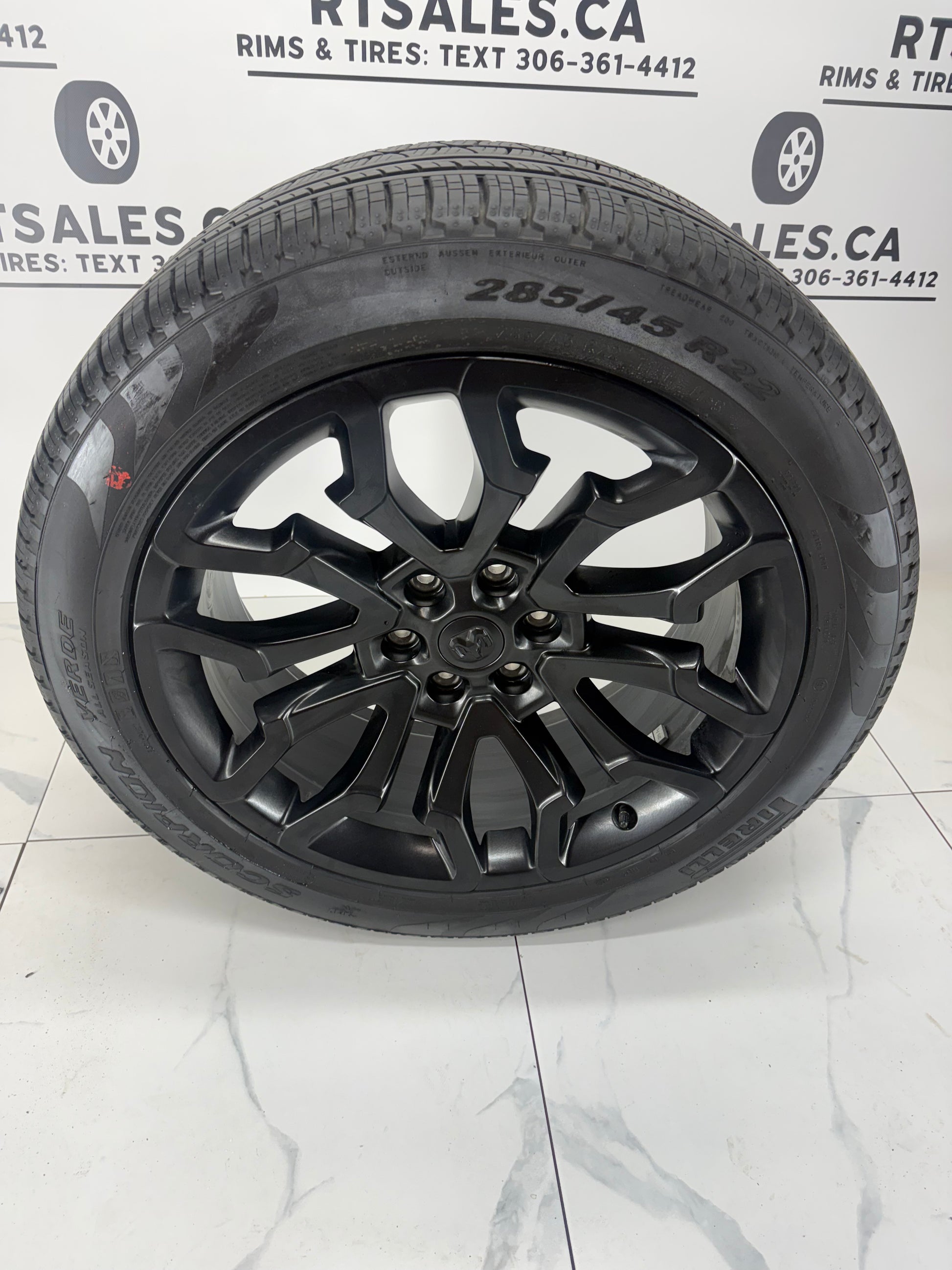 Ram 1500 22x9 factory black rim, 6x139.7 bolt pattern, angled view
