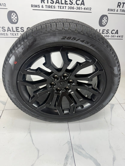 Ram 1500 22x9 factory black rim, 6x139.7 bolt pattern, angled view